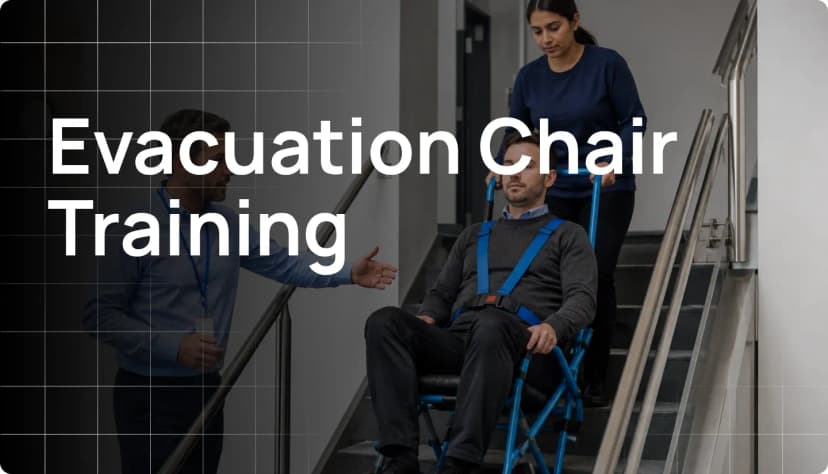 Evacuation chair training with instructor demonstrating safe stair evacuation