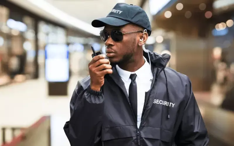Security guard using a radio during SIA Security Guard training